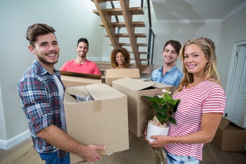 Stacked storage boxes and furniture ready for a transparent storage quote