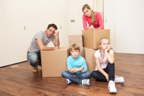 Professional movers handling furniture during a local house move